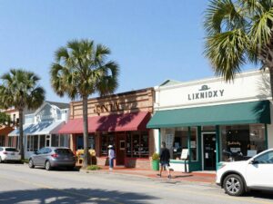 A bustling street in Charleston showcasing small businesses and community engagement.