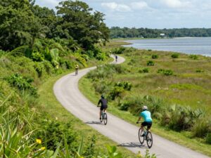 Cyclists enjoying the scenic bike trails in the Lowcountry