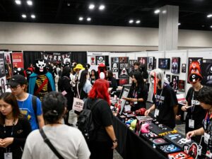 Fans enjoying the Spooky Empire horror convention with costumes and memorabilia.