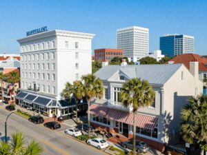 A beautiful view of Charleston's hospitality sector featuring historic buildings and modern hotels.