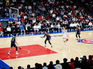 Players on the court celebrating a basketball victory