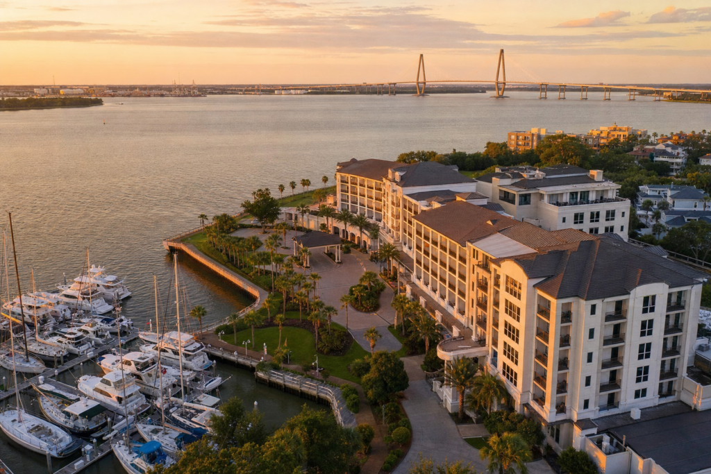 Aerial view of a Charleston Harbor Resort at golden hour with marina in foreground