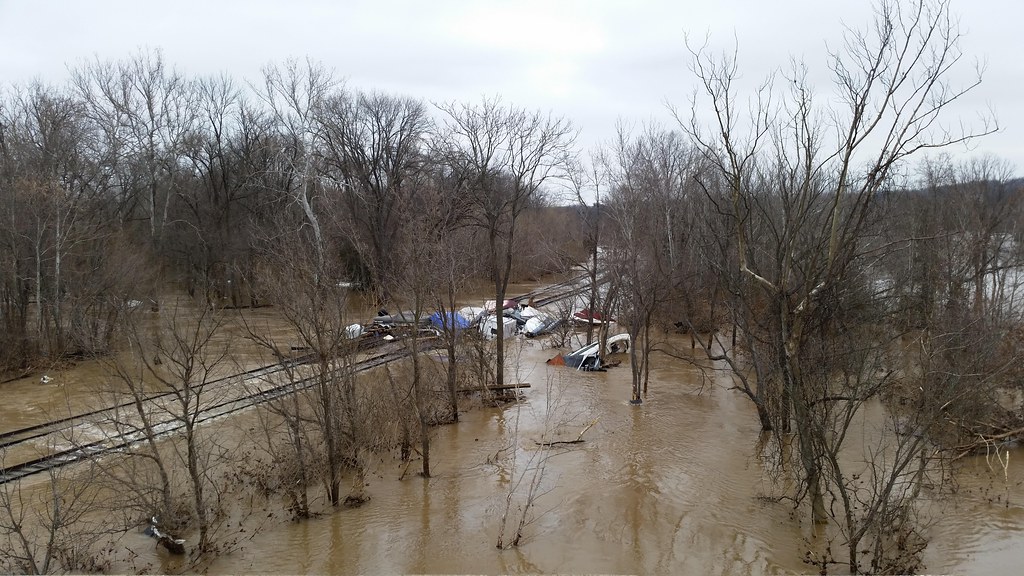 Floodwater covering a low-lying roadway