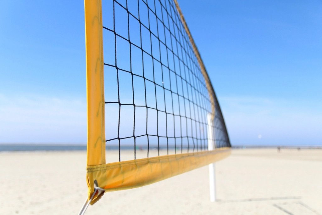 High school volleyball players at the net