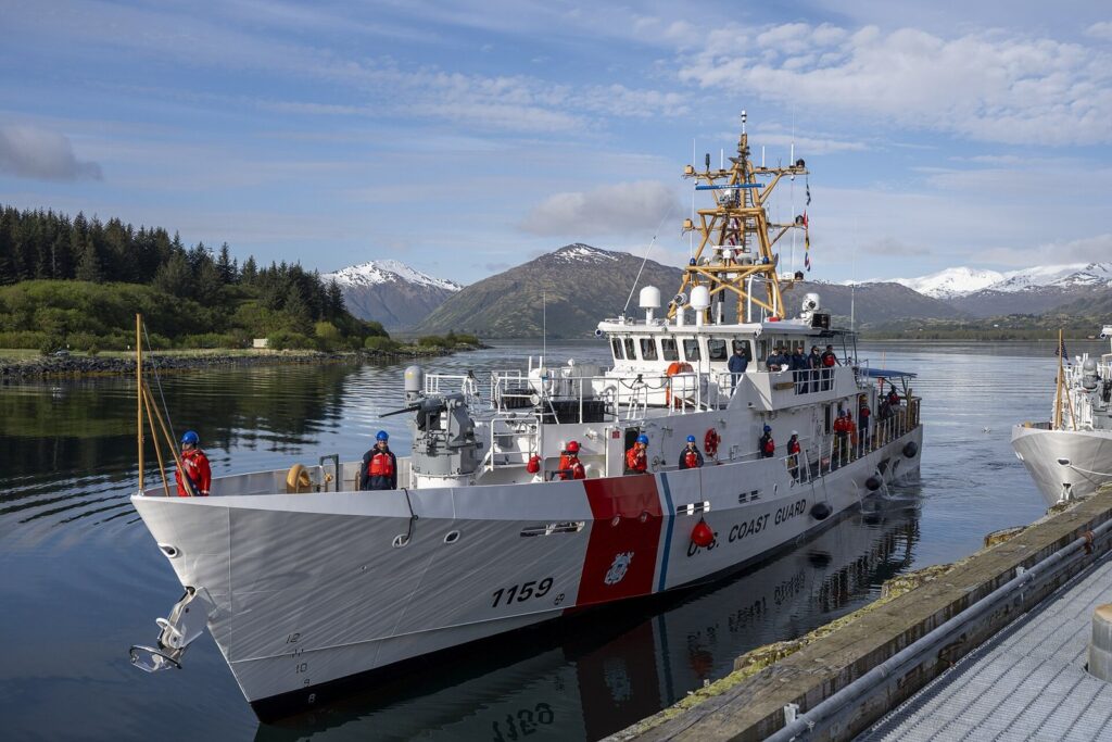 Coast Guard cutter arriving at a base